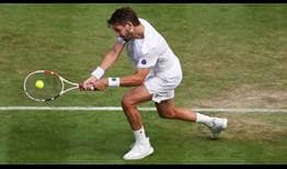 Cameron Norrie conecta un revés ante Tommy Paul en la cuarta ronda de Wimbledon.