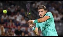 Pablo Carreno Busta holds off Daniel Evans to clinch a three-set semi-final triumph in Montreal on Saturday.