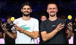 Hugo Nys and Jan Zielinski lift their maiden tour-level trophy as a team at the Moselle Open in Metz on Sunday afternoon.