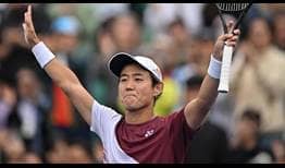 Yoshihito Nishioka celebrates clinching his second ATP Tour title on Sunday at the Eugene Korea Open Tennis Championships in Seoul.