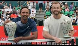 Raven Klaasen and Nathaniel Lammons celebrate their maiden ATP Tour title as a team on Sunday at the Eugene Korea Open Tennis Championships in Seoul.