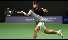 Luca Nardi strikes a forehand during his win against David Goffin in Astana qualifying on Sunday.