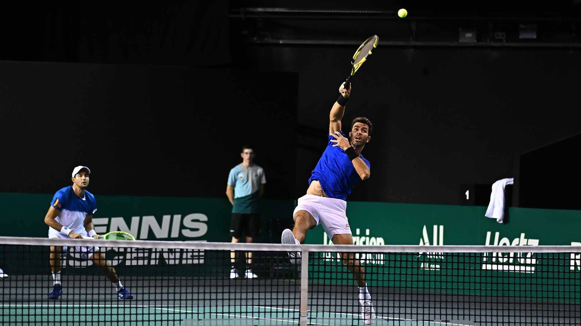Marcelo Arevalo and Jean-Julien Rojer (front) fall to Matt Ebden and Jamie Murray in Paris Thursday.