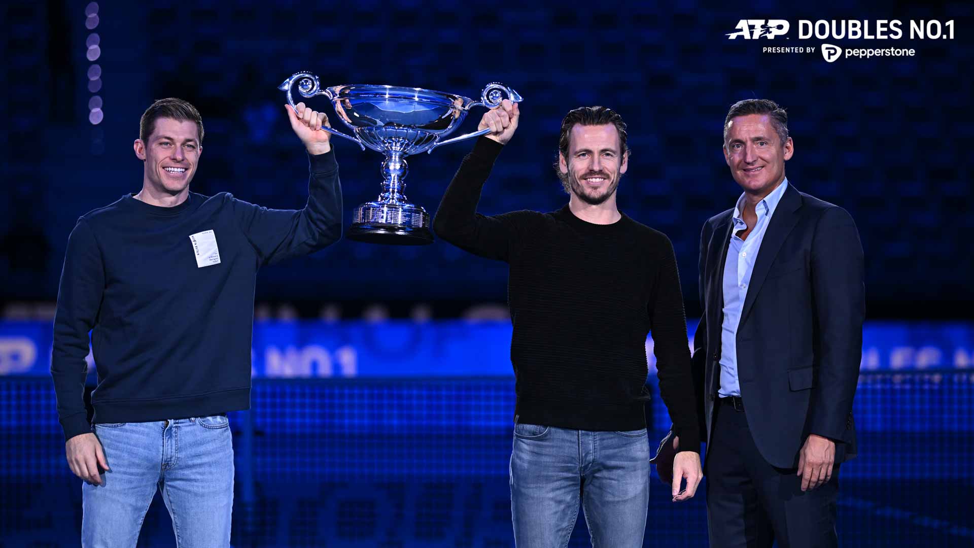 Neal Skupski and Wesley Koolhof receive the ATP Doubles No. 1 presented by Pepperstone trophy from ATP Chairman Andrea Gaudenzi on Thursday.