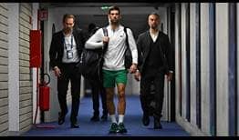 Novak Djokovic walks toward the stadium court for his semi-final at the Pala Alpiour in Turin.