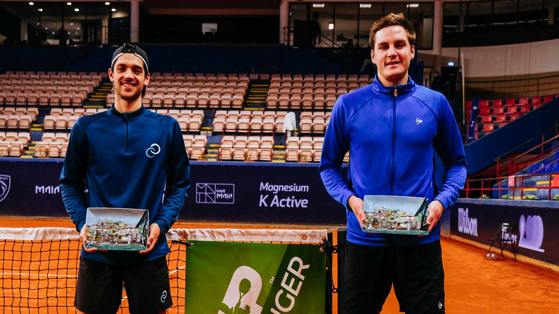<a href='https://www.atptour.com/en/players/julian-cash/ci96/overview'>Julian Cash</a> (left) and <a href='https://www.atptour.com/en/players/henry-patten/p0g6/overview'>Henry Patten</a> are crowned champions at the Maia Challenger.