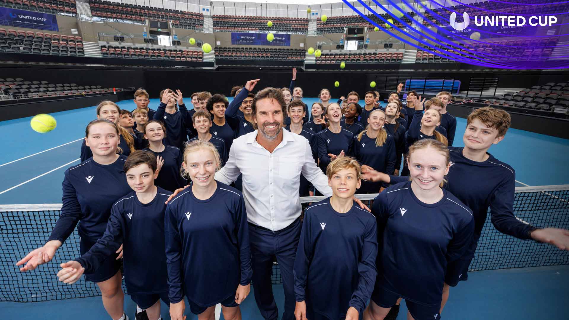 Patrick Rafter meets ball kids on Sunday at Brisbane's Pat Rafter Arena, a group-stage venue for the inaugrual United Cup.