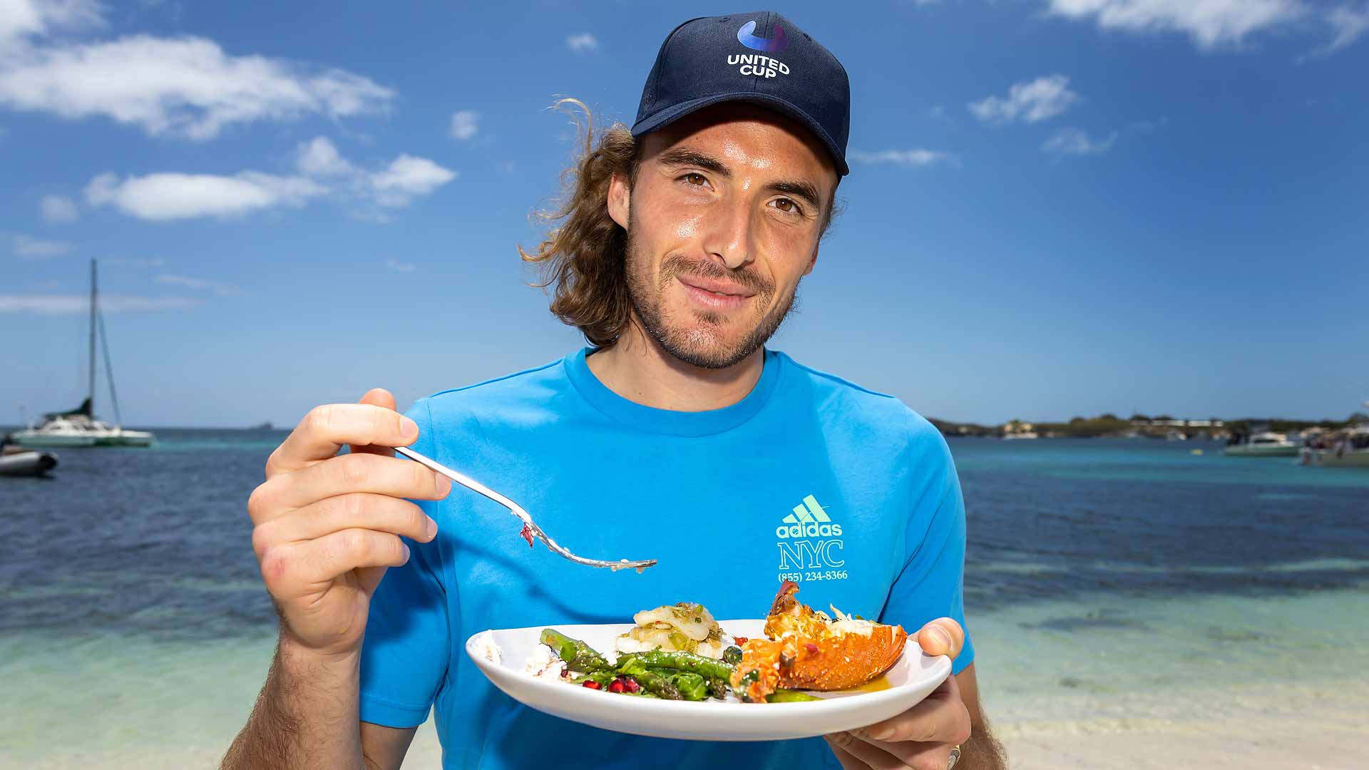 Stefanos Tsitsipas enjoys a seafood lunch while visiting Rottnest Island on Tuesday.