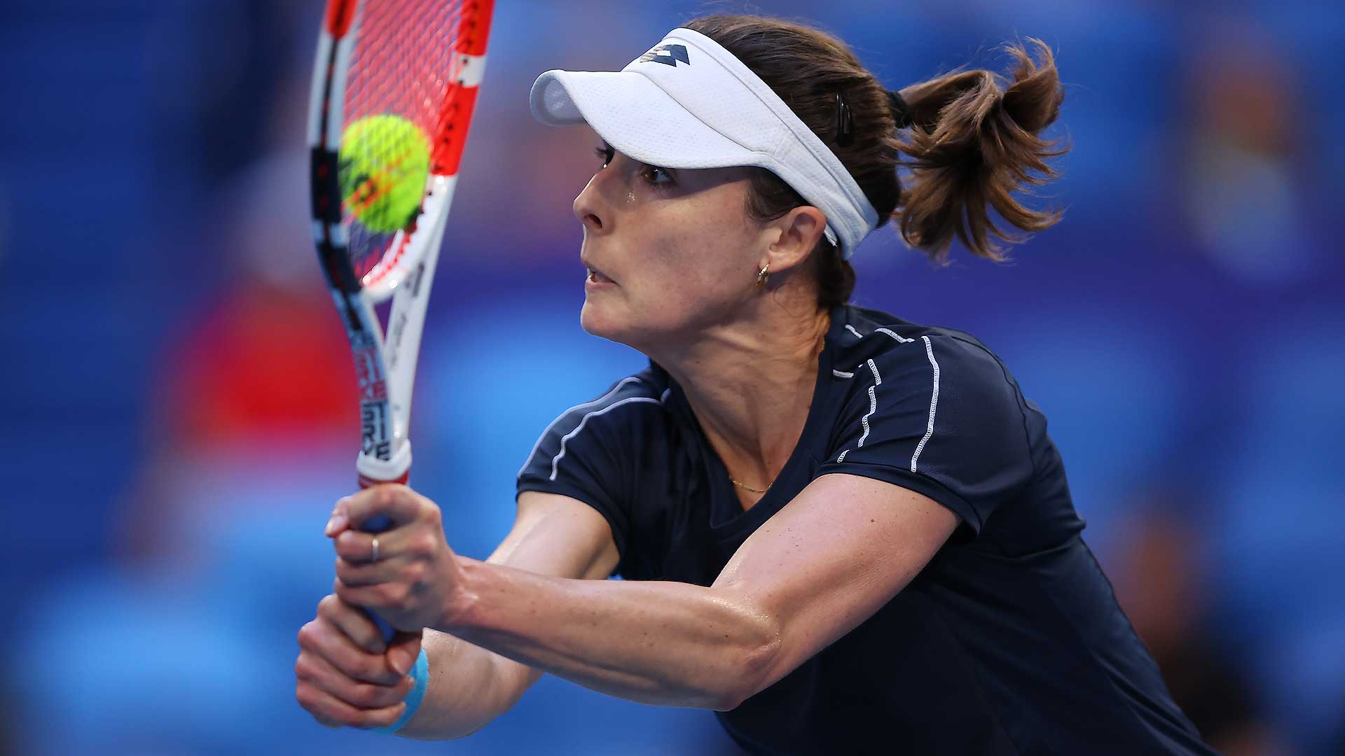 Alize Cornet comes to the net during her straight-sets win against Maria Lourdes Carle on Thursday in Perth.