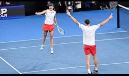 Iga Swiatek and Hubert Hurkacz celebrate their deciding mixed doubles win on Wednesday evening in Brisbane.