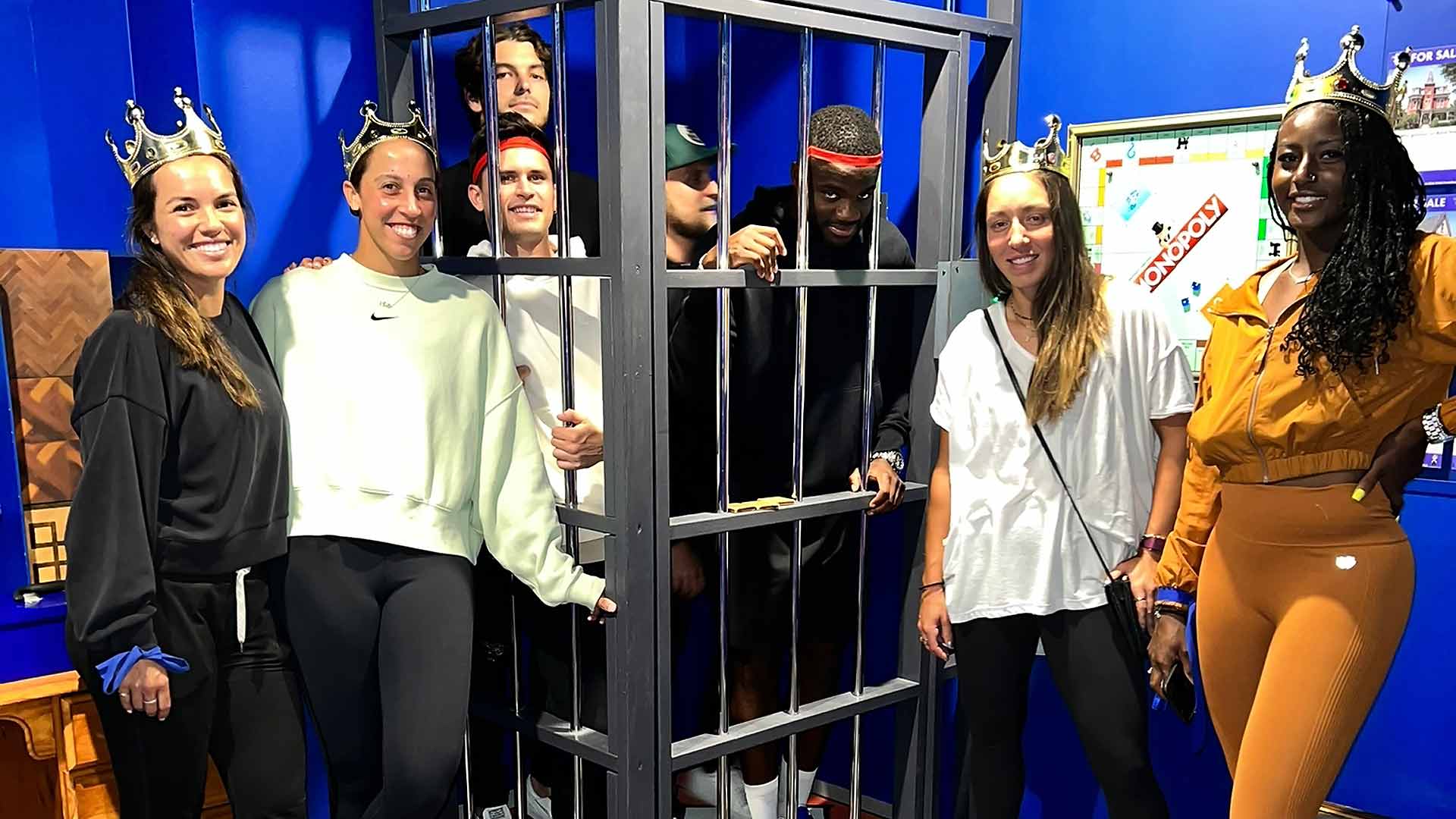 The women of Team United States celebrate their victory against their countrymen at an escape room in Sydney.