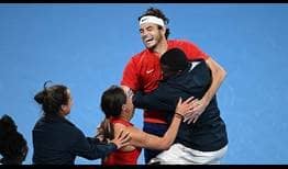 Team United States celebrates Taylor Fritz's victory against Matteo Berrettini, which clinched their United Cup triumph.