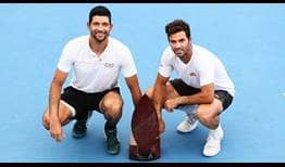 Marcelo Arevalo and Jean-Julien Rojer pose with their fifth tour-level title as a pair.