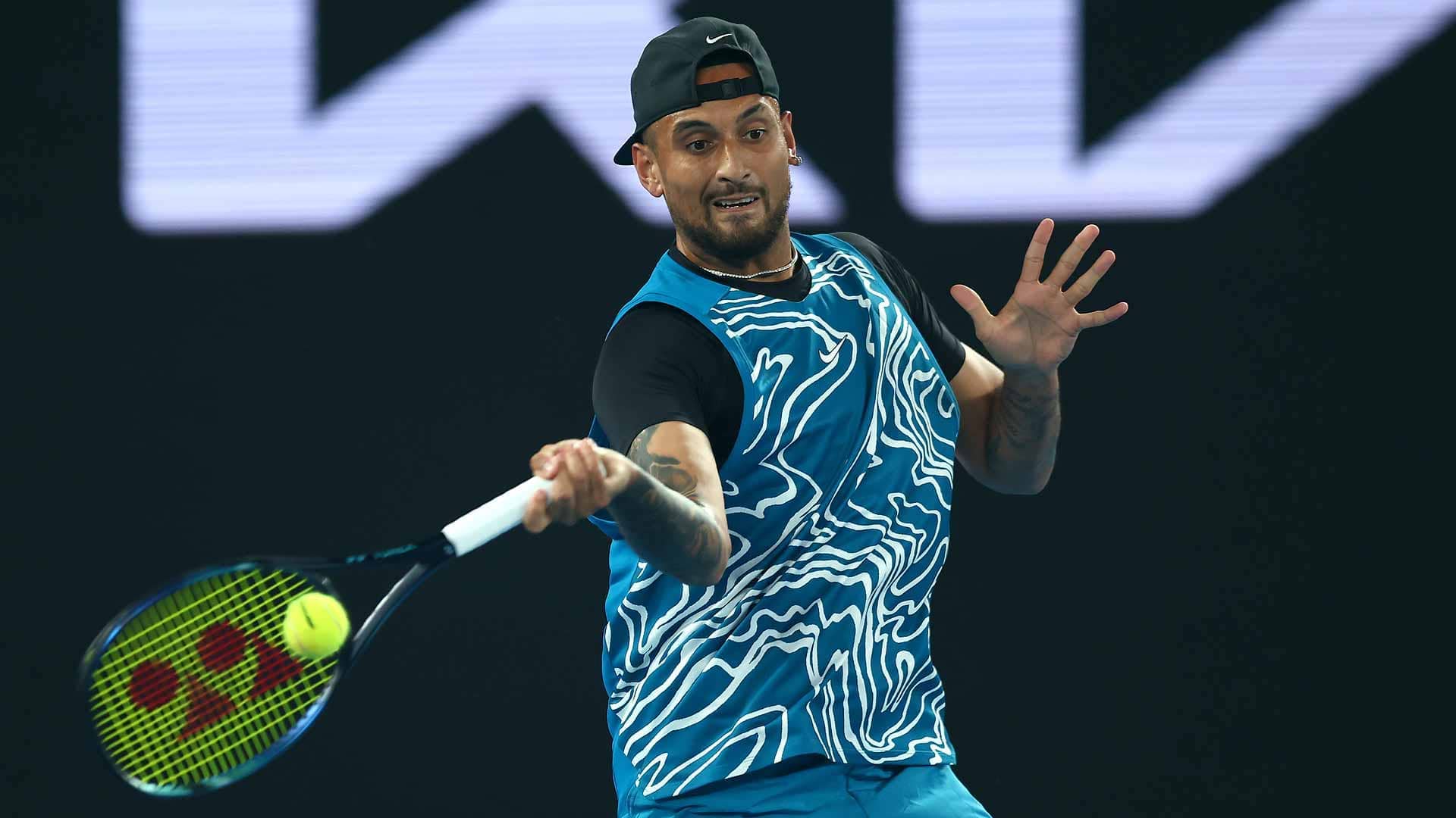 Nick Kyrgios fires a forehand during a charity match against Novak Djokovic on Friday night in Melbourne.