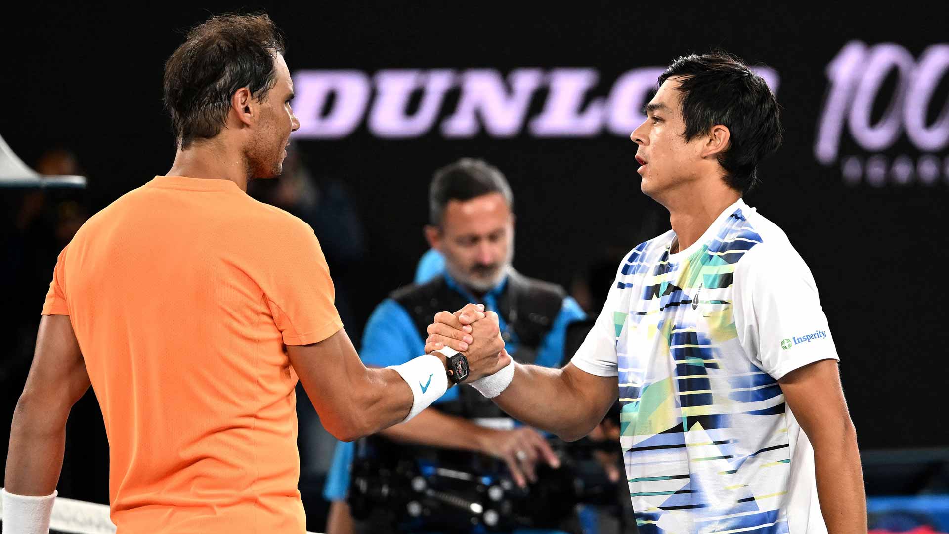 Rafael Nadal and Mackenzie McDonald shake hands after the American wins their second-round match at the Australian Open.