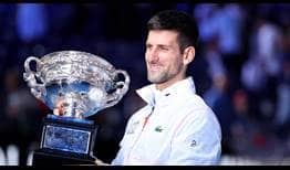 Novak Djokovic celebrates capturing a record-extending 10th Australian Open crown.
