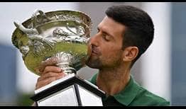 Novak Djokovic poses at the 2023 Australian Open Champion Photoshoot.