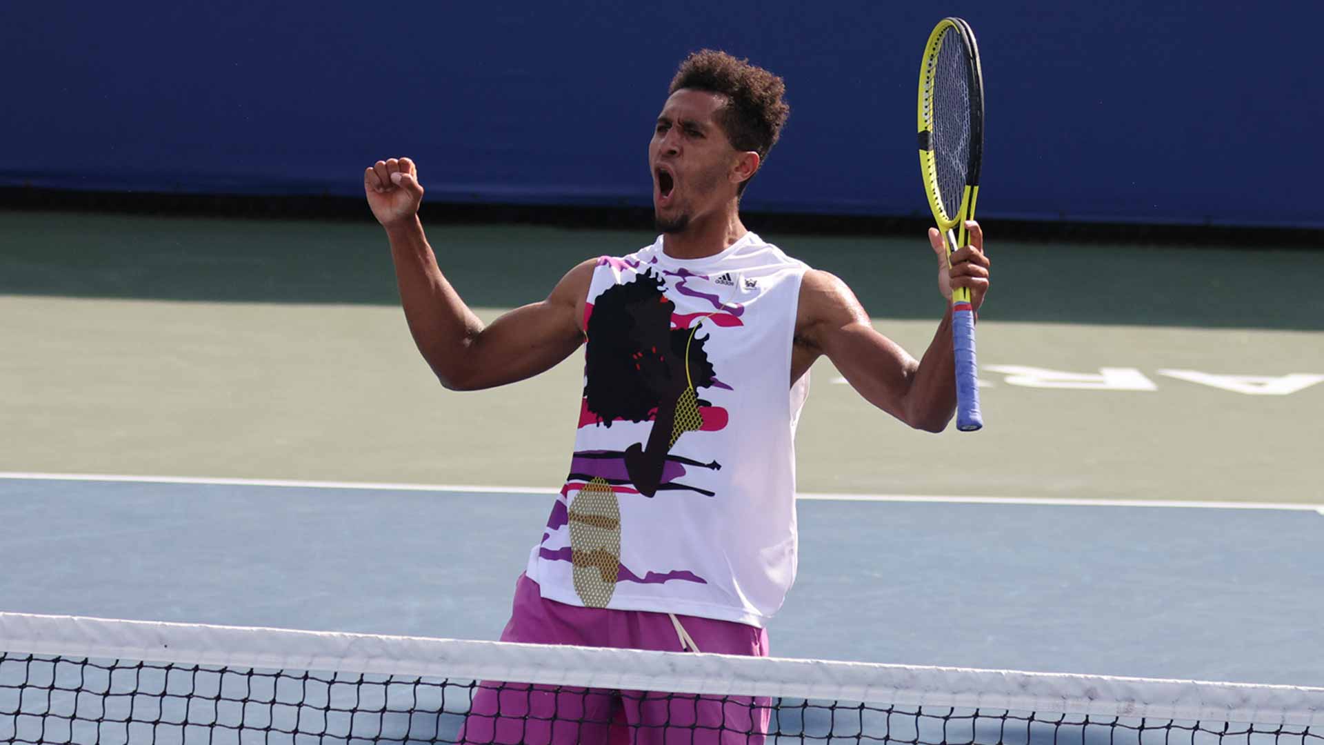 Michael Mmoh celebrates winning the Cary Challenger in September 2022.