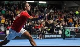 Serbia's Laslo Djere saves a match point in a third-set tie-break en route to victory against Norway's Viktor Durasovic.