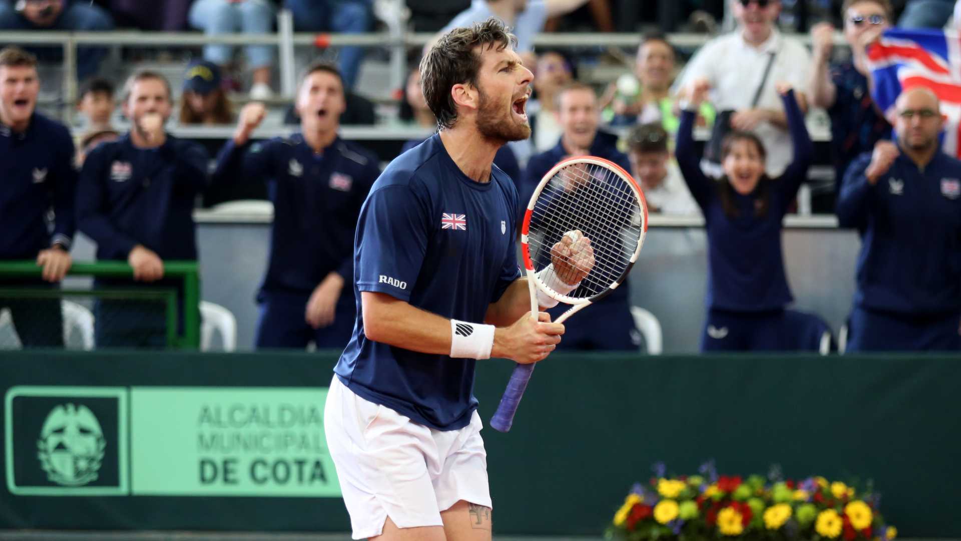 Cameron Norrie celebrates his tie-clinching Davis Cup Qualifier win for Great Britain against Colombia.