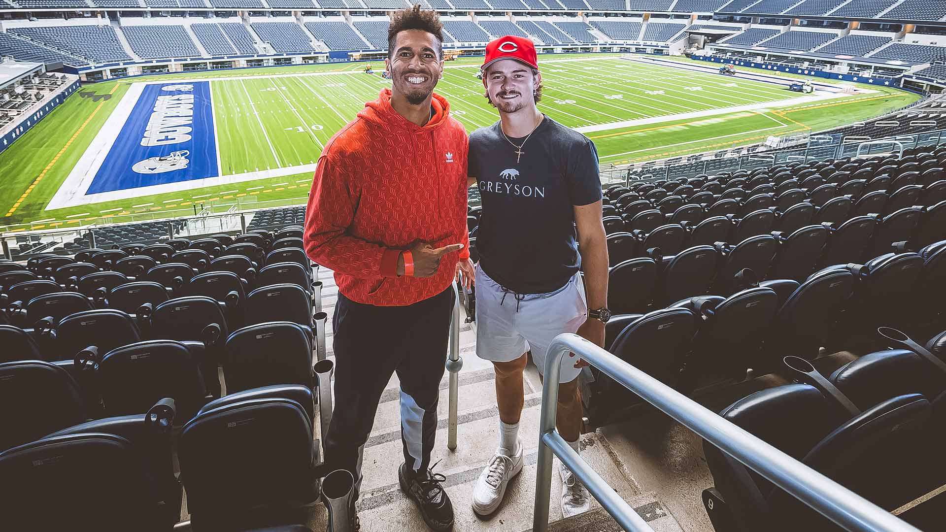 Michael Mmoh (left) and J.J. Wolf visit AT&T Stadium near Dallas, Texas.