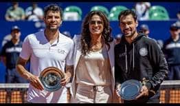 Buenos Aires doubles champions Simone Bolelli and Fabio Fognini pose alongside Gabriela Sabatini with their trophies.
