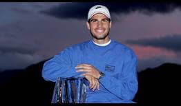 Carlos Alcaraz poses with his maiden Indian Wells trophy.