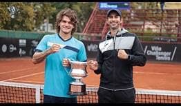 Thiago Seyboth Wild (left) is the champion in Vina del Mar, celebrating his first ATP Challenger title in four years with coach Duda Matos.