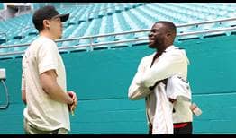 Miami Heat star Duncan Robinson enjoys a conversation with Frances Tiafoe on Thursday inside Hard Rock Stadium.