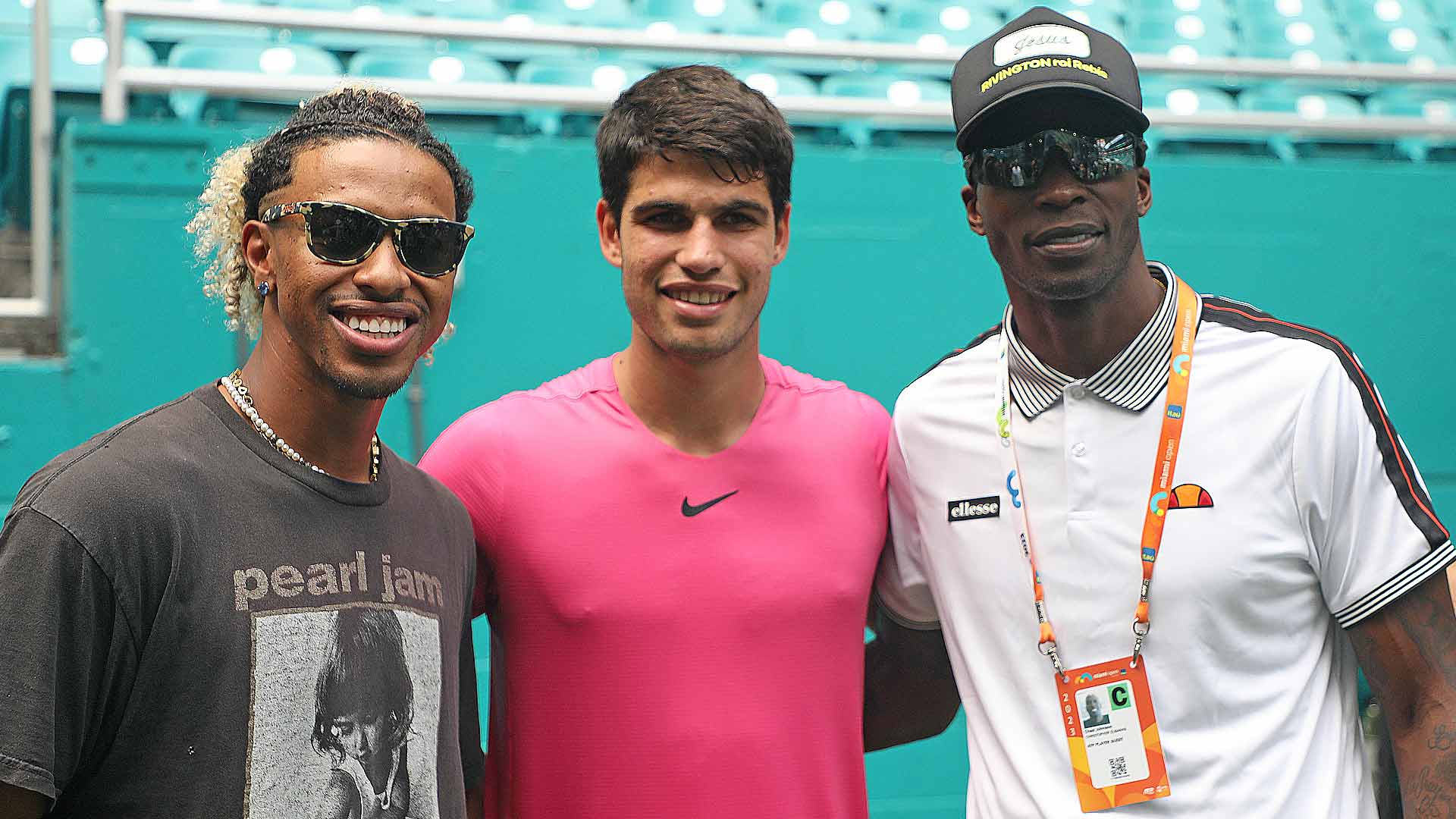 Francisco Lindor, Carlos Alcaraz and Chad Johnson pose for a photo inside Hard Rock Stadium after the Spaniard's fourth-round victory.