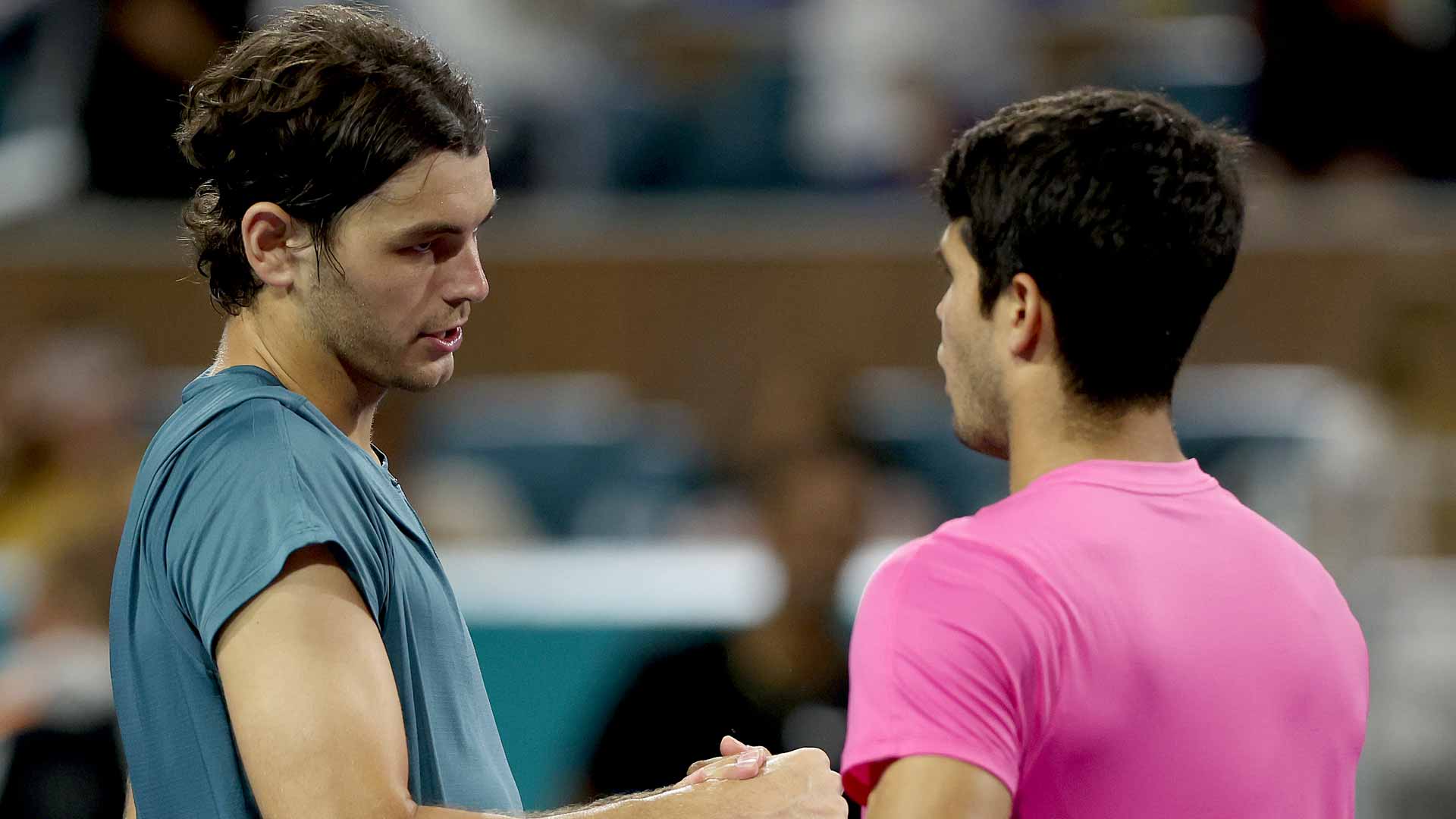 Taylor Fritz and Carlos Alcaraz embrace following their quarter-final clash in Miami.