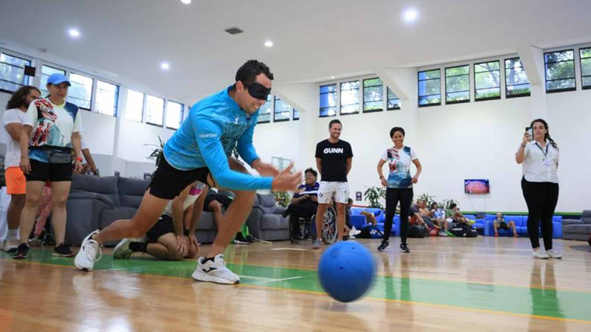 <a href='https://www.atptour.com/en/players/daniel-elahi-galan/ge33/overview'>Daniel Elahi Galan</a> learns to play goalball.