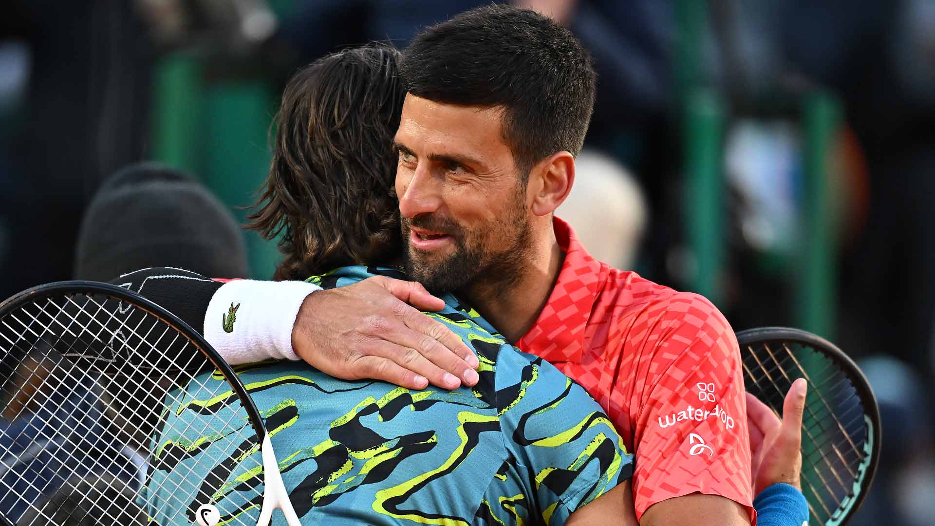 Novak Djokovic hugs Lorenzo Musetti after their match Thursday in Monte-Carlo.