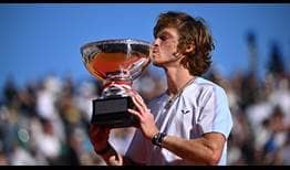 Andrey Rublev celebrates winning his 13th tour-level title and first ATP Masters 1000 crown in Monte-Carlo.