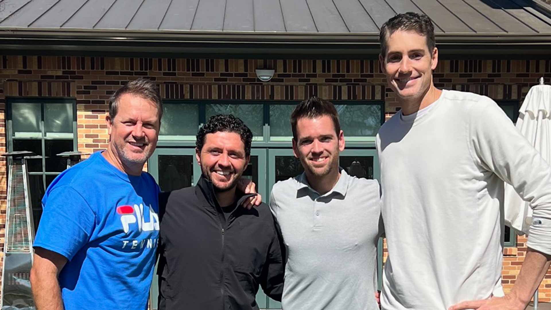 Philip Farmer and the three ATP Tour player he coaches: Hans Hach Verdugo, Austin Krajicek and John Isner.