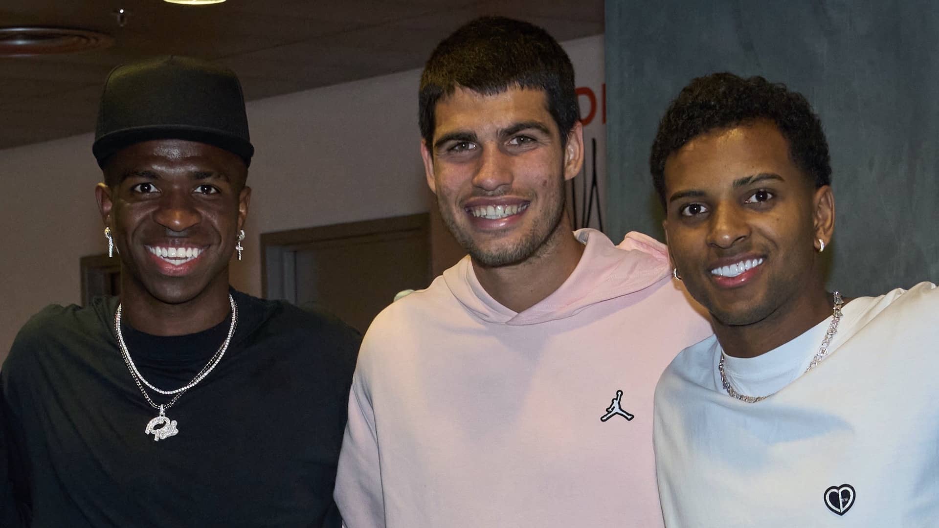 Vinicius Junior and Rodrygo of Real Madrid meet with Carlos Alcaraz after his win on Sunday.