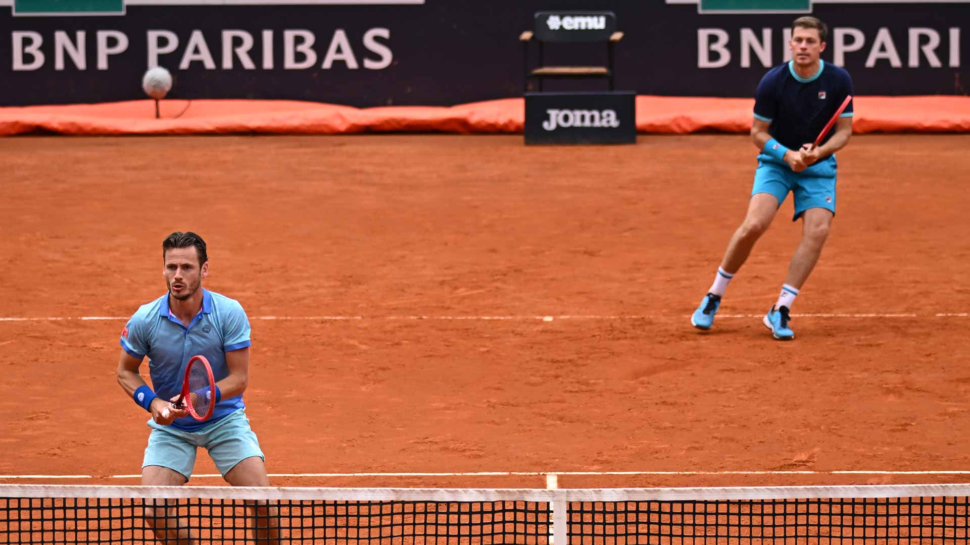 Wesley Koolhof (at net) and Neal Skupski during Tuesday's Rome action.