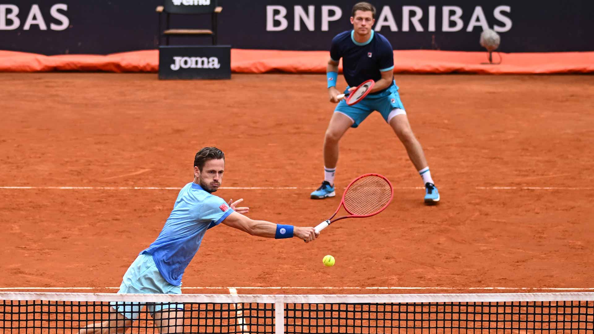 Wesley Koolhof (at net) and Neal Skupski during Rome doubles action.