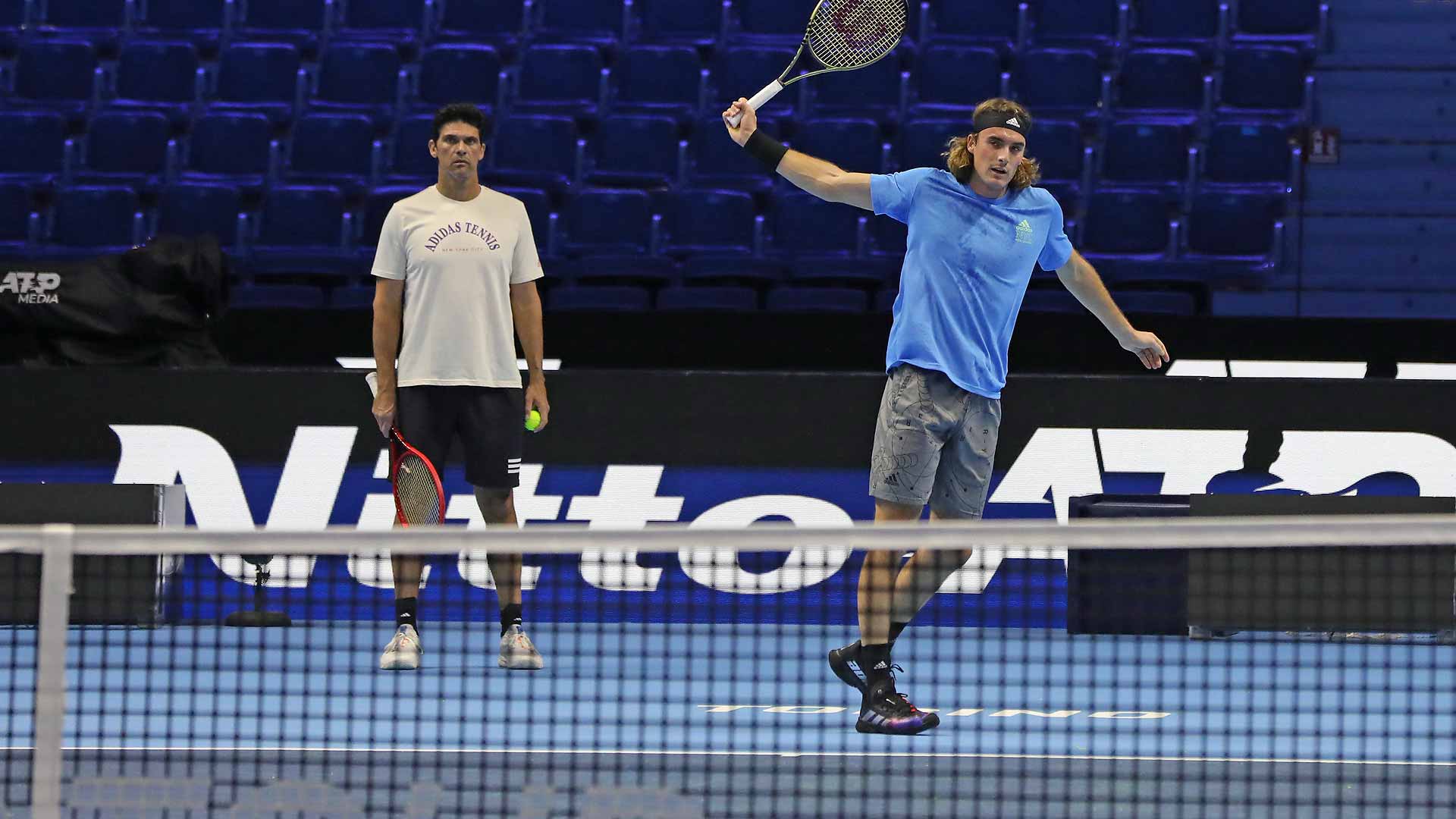 Mark Philippoussis watches Stefanos Tsitsipas train at the 2022 Nitto ATP Finals in Turin.