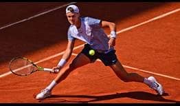 Holger Rune chases down a ball during his fourth-round match against Francisco Cerundolo on Monday at Roland Garros.