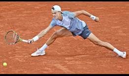 Holger Rune slides for a ball en route to victory against Francisco Cerundolo on Monday at Roland Garros.