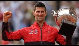 Novak Djokovic celebrates winning a record 23rd major.