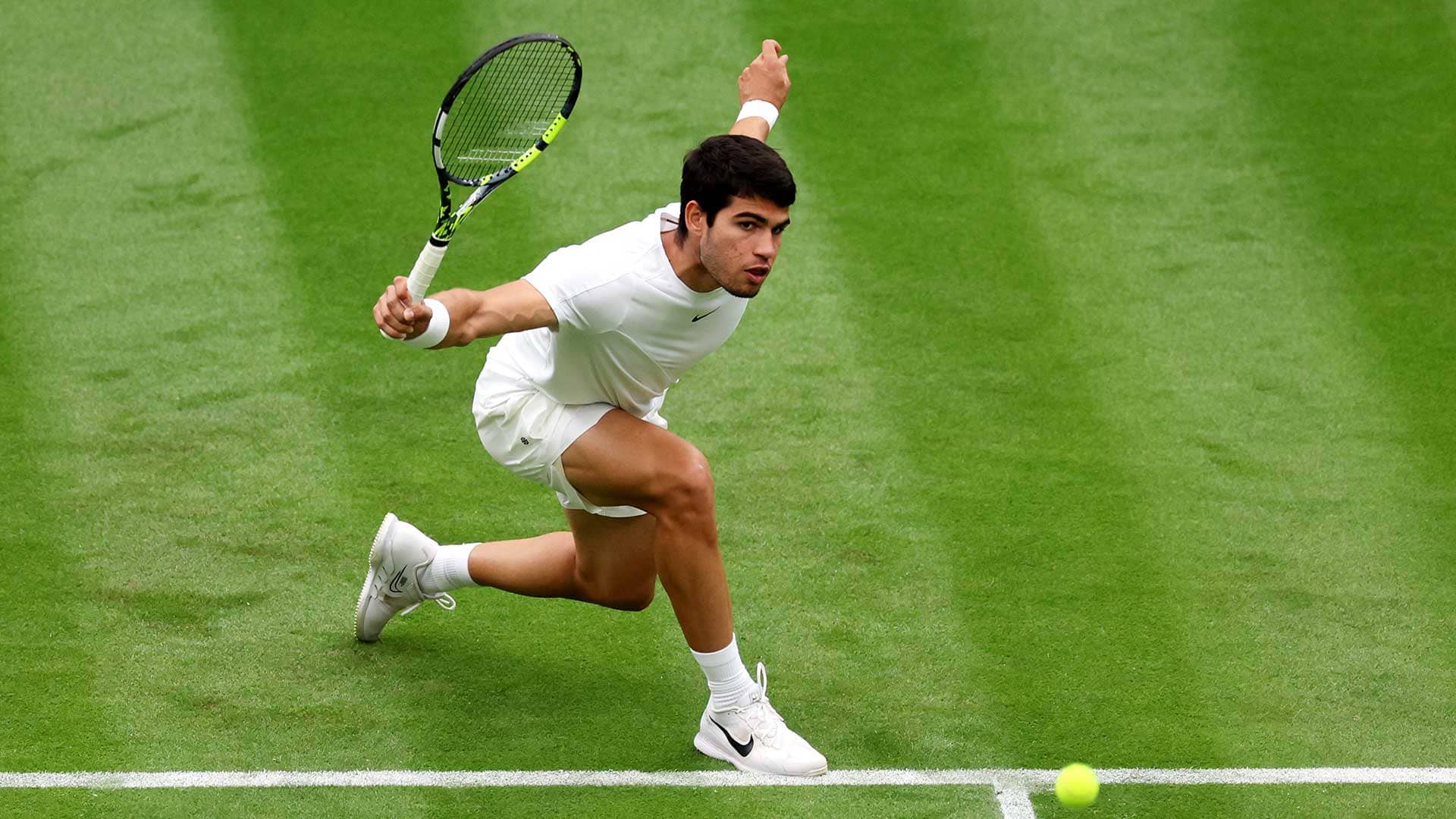 Carlos Alcaraz in action on Tuesday at Wimbledon.
