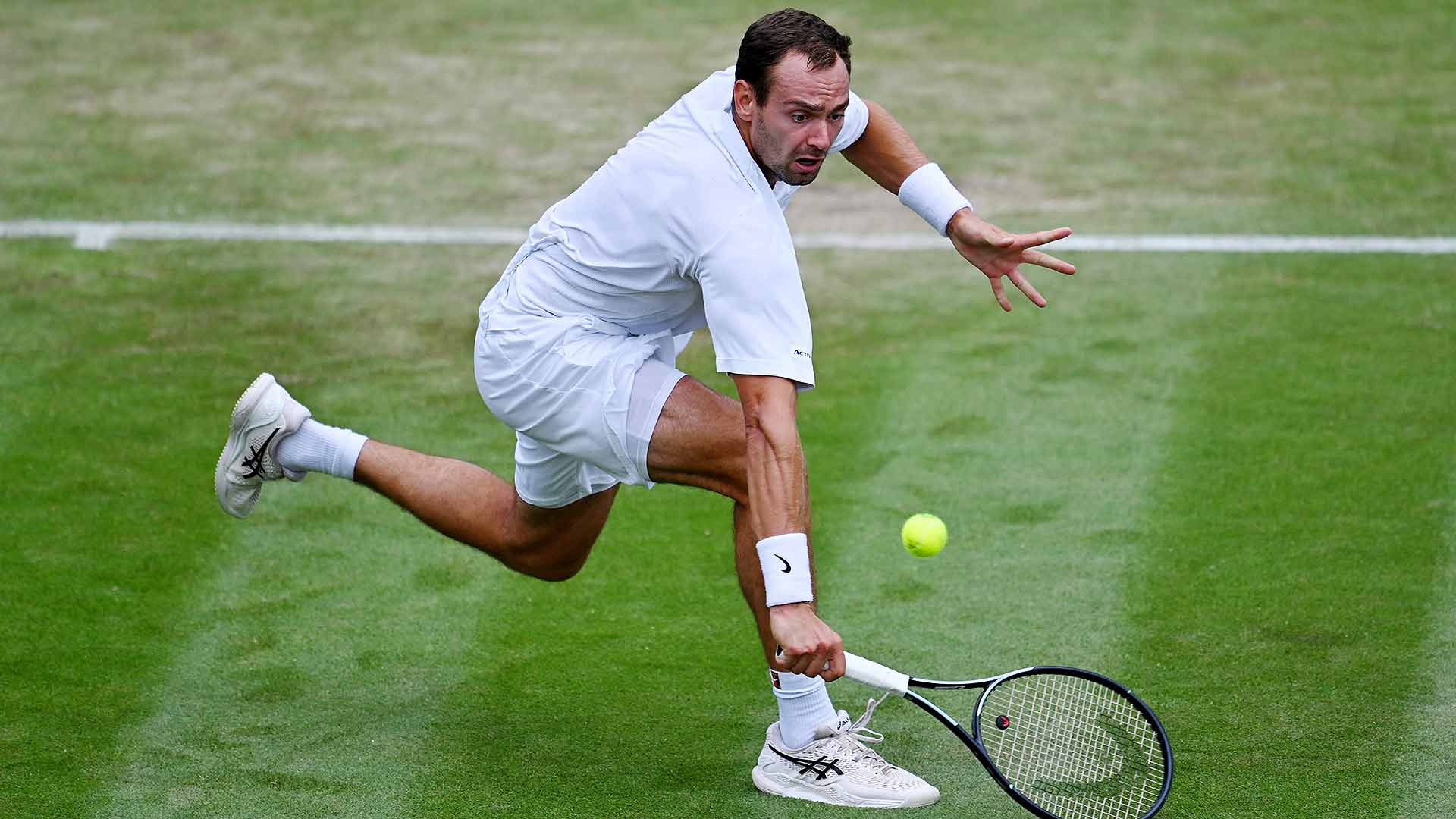Roman Safiullin is through to the quarter-finals in his Wimbledon debut.