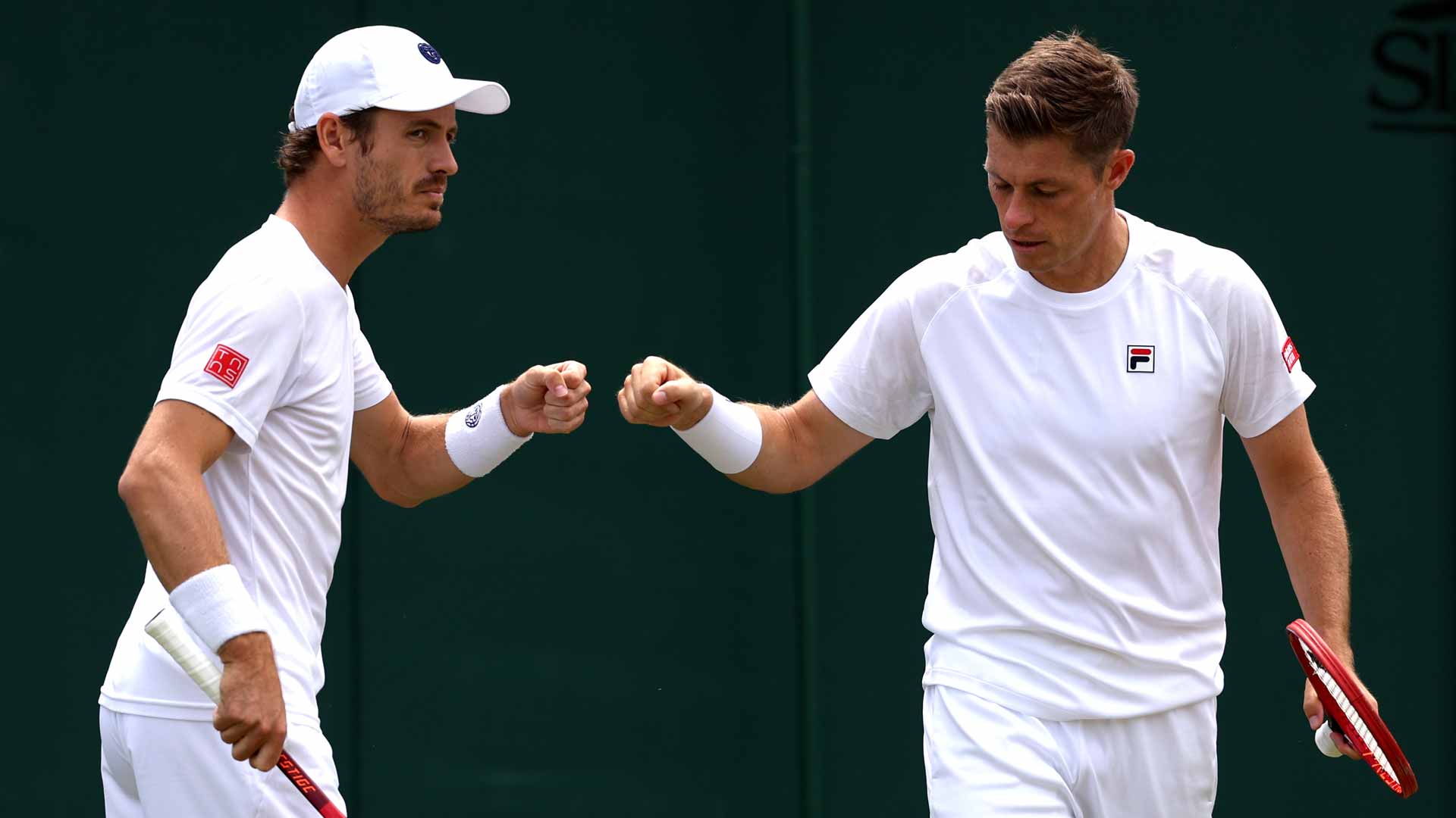 Wesley Koolhof and Neal Skupski in action at Wimbledon.