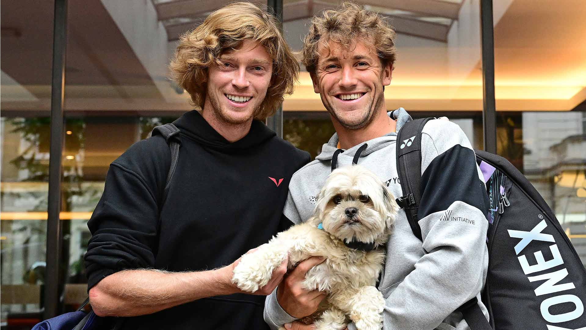 Andrey Rublev and Casper Ruud, who could meet in the Hamburg final, pose with Ruud's dog, Bajas.