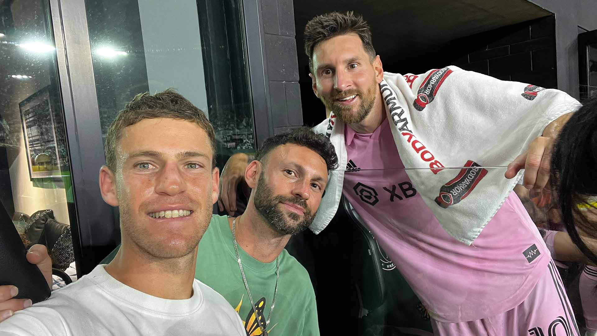 Diego Schwartzman and his brother Matias Schwartzman take a photo with football superstar Lionel Messi on Tuesday.