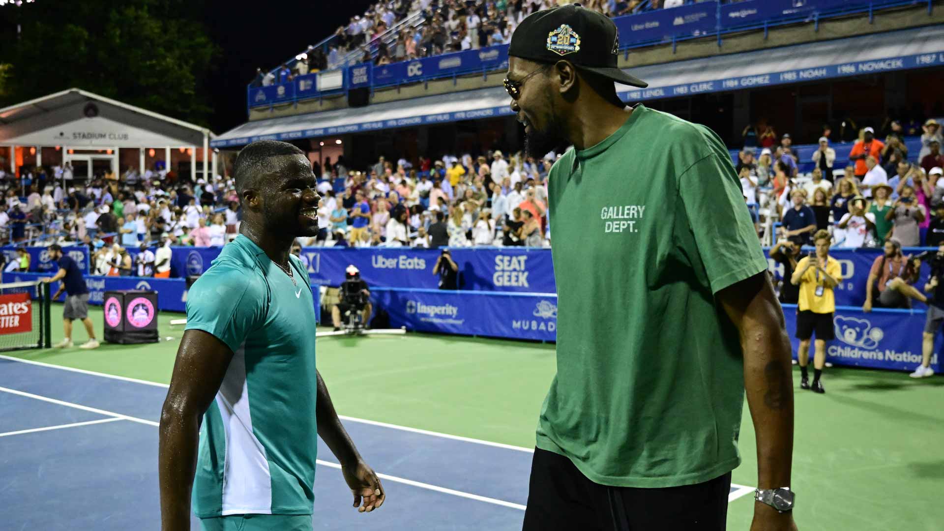 Frances Tiafoe and Kevin Durant greet each other after Tiafoe's Tuesday evening win in Washington.