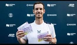 Andy Murray poses with Positivity Postcards he received from fans in Toronto.