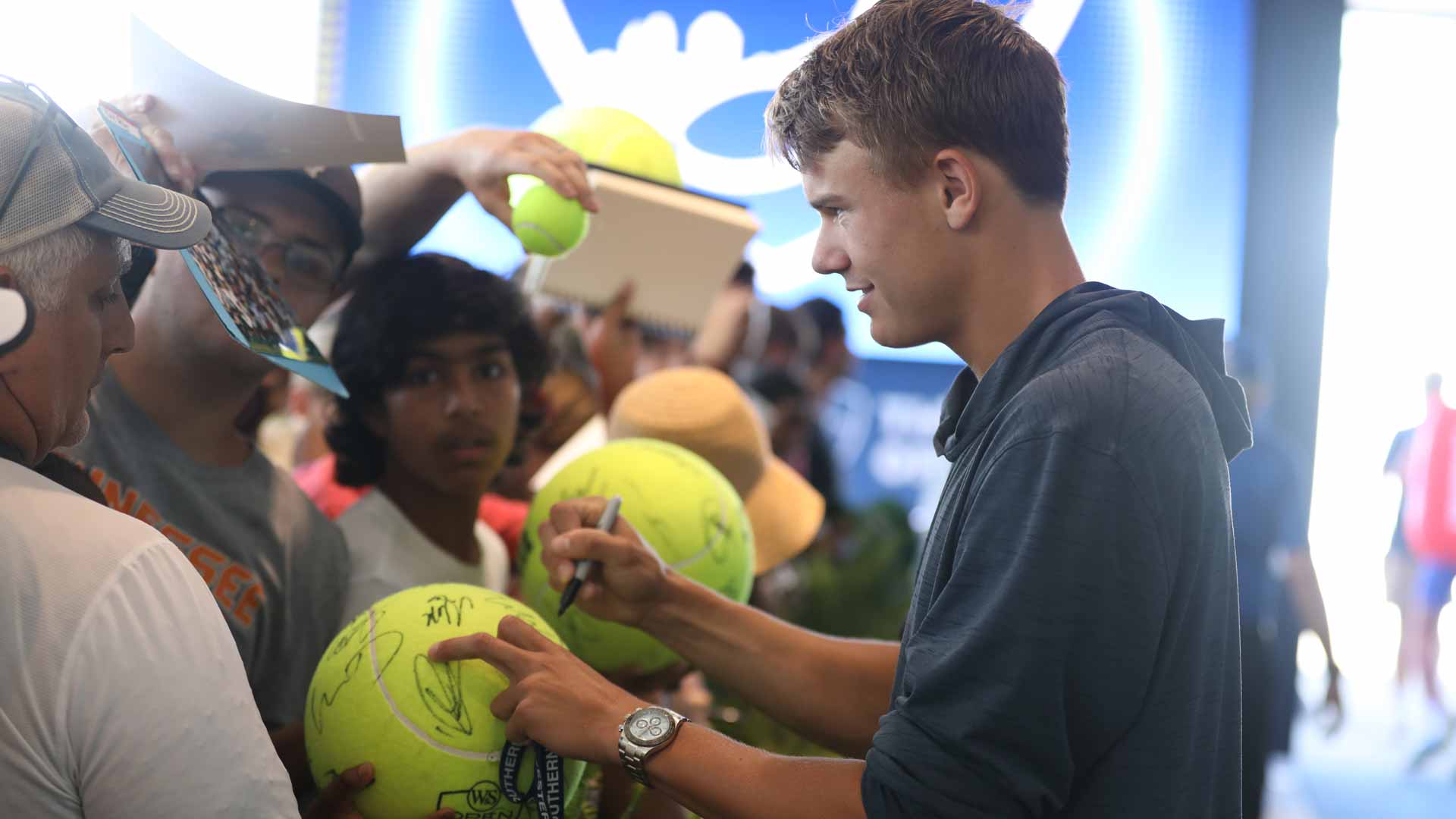 Holger Rune signs autographs at the Western & Southern Open.